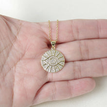 Close up view of evil eye stainless steel necklace. 