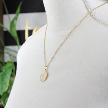 Gold stainless steel Evil Eye rhinestone pendant necklace with sparkling crystal accents side view mannequin