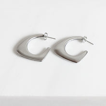 Contoured Silver Drop Earrings Stainless Steel side view on white background. 