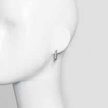 Geometric Rhinestone Drop Earrings on a mannequin against a white background.