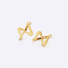 Wavy ribbon stainless steel gold drop earrings on a white background. 