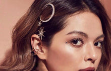Gold crescent moon hair clip and star hair pins on model. 