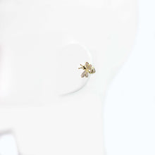 Side view of 10mm gold rhinestone bee ear cuff clip-on worn on cartilage