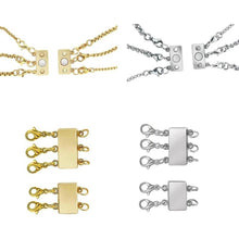 Gold and silver necklace layering clasps for connecting multiple necklaces.