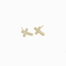 A pair of 18K gold plated cross stud earrings with cubic zirconia accents.