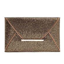 Stylish and chic envelope clutch. Interior lining with two small pockets. Clutch measures 11 1/2" wide by 7" tall. Available in black or bronze.