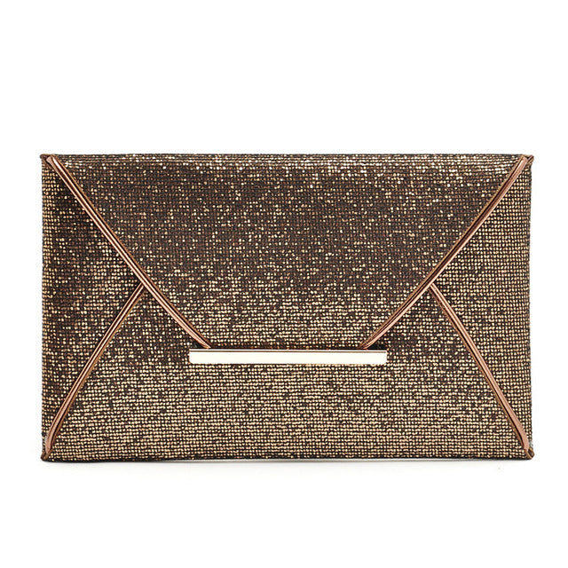 Stylish and chic envelope clutch. Interior lining with two small pockets. Clutch measures 11 1/2