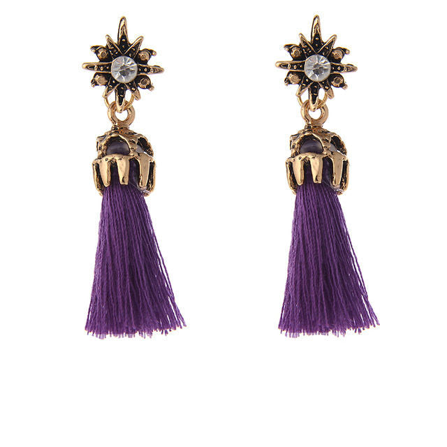 Antique gold color star stud with rhinestone and purple tassel. Remove the tassel to wear the star studs alone. Earrings measure 1 3/4