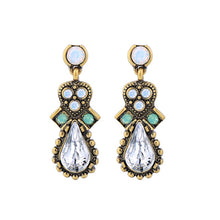 Vintage gold tone waterdrop earrings with beautiful teal and light blue opal rhinestones. Earrings measure 1 1/4" long.