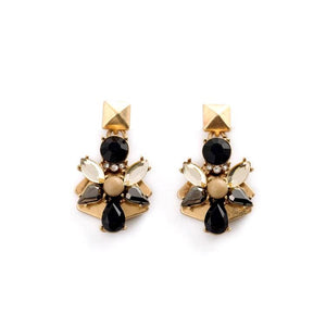 Unique vintage art deco gold tone earrings with black gemstones. Earrings measure 1 1/2" long. 