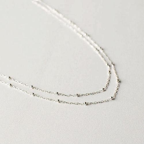 Long silver tone beaded chain necklace can be worn three different ways so you get three different looks for the price of one! Necklace measures 52