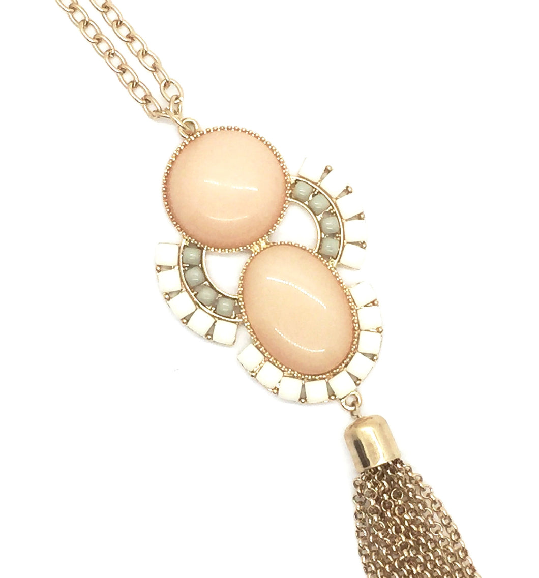 Beautiful long necklace with peach, ivory, and grey stones. Gold chain tassel.  Necklace measures 30