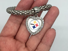 Show the love of your football team with this Steelers pendant bracelet. Heart shaped rhinestone pendant. Stretch bracelet measures 6 1/2". Heart pendant measures 1" long by 7/8" wide.