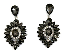 Elegant grey and clear rhinestone earrings in a silver metal color. Earrings measure 2" long by 1 1/4" wide. 