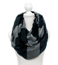 Casual and comfortable bold stripe scarf with shimmering threads for a bit of sparkle. Edges are frayed for a casual look.