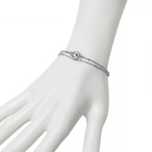 Silver double beaded chain bracelet with oval rhinestone center charm on mannequin. 