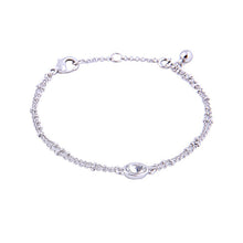 Silver double beaded chain bracelet with oval rhinestone center charm.