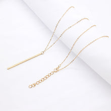 Trendy bar necklace that is modern and will add style to your outfit. Available colors: silver, gold, and black.