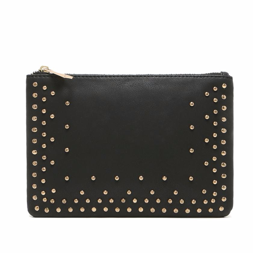 Black gold studded clutch has lined interior, pocket for cell phone, and a zippered pocket. Clutch measures 6 1/2