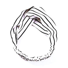 Stylish twist loop nylon headband with elastic for comfort fit. Colors: White with black stripes.