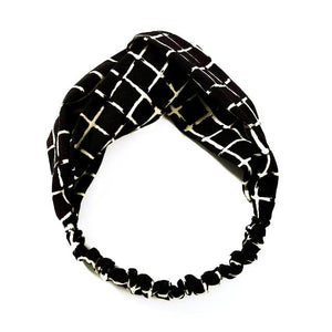 Stylish twist loop nylon headband with elastic for comfort fit. Colors: Black with khaki square pattern.