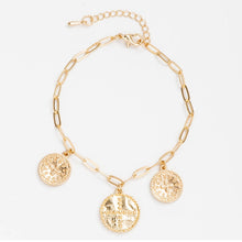 Gold paperclip chain bracelet with cross charms