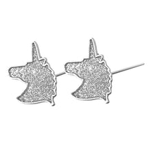 Adorable silver enameled glitter unicorn earrings. Earrings measure 3/4" long by 1/2" wide.